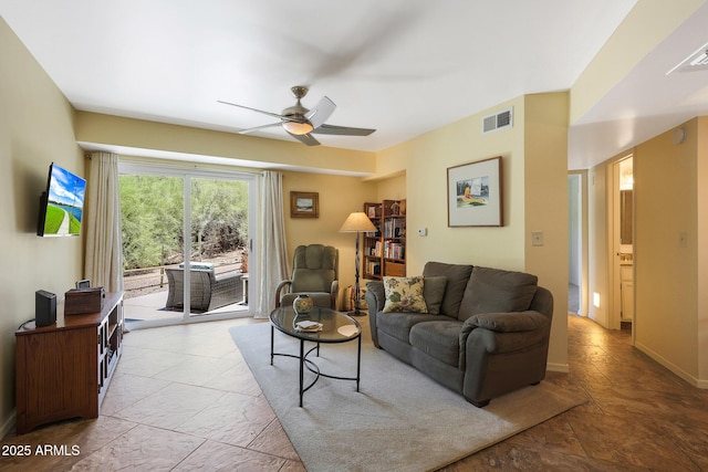16108 E Emerald Dr Unit 106, Fountain Hills, AZ 85268 - living room featuring ceiling fan and stone finish floors