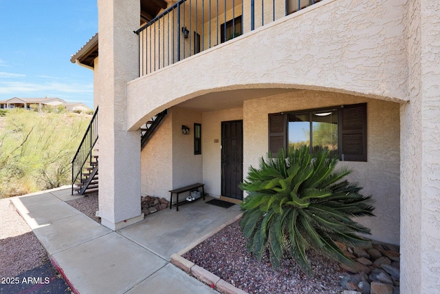 16108 E Emerald Dr Unit 106, Fountain Hills, AZ 85268 - property entrance with stucco siding and a balcony