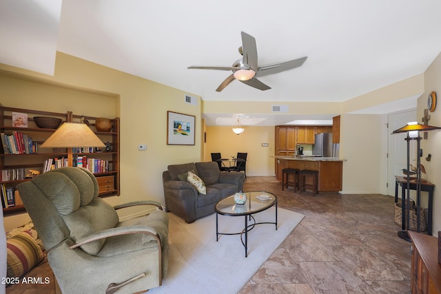 16108 E Emerald Dr Unit 106, Fountain Hills, AZ 85268 - living room with a ceiling fan and stone finish flooring