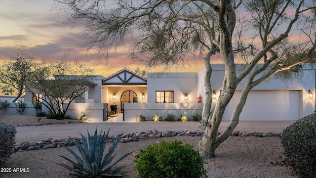 view of front of property with a garage