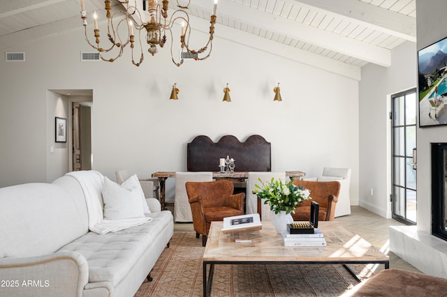 living room featuring lofted ceiling with beams, wooden ceiling, light parquet floors, and a notable chandelier