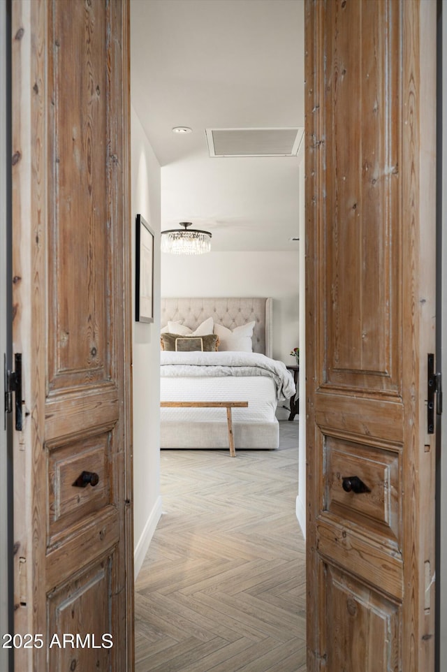 corridor with light parquet floors