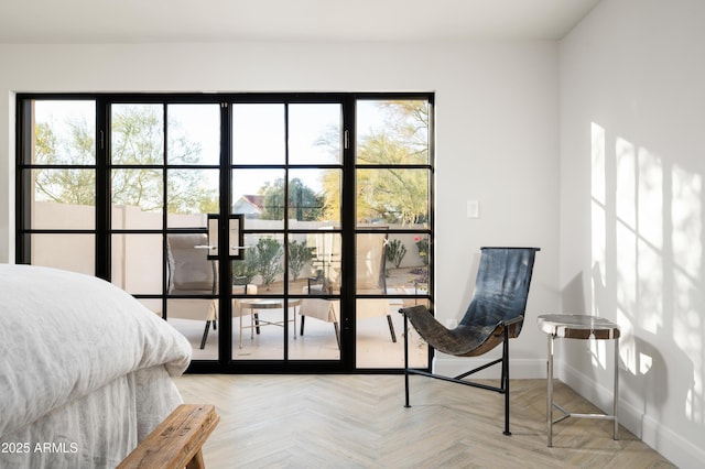 bedroom featuring parquet floors and multiple windows