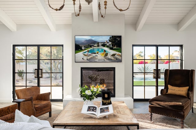 living room with hardwood / wood-style flooring and beam ceiling