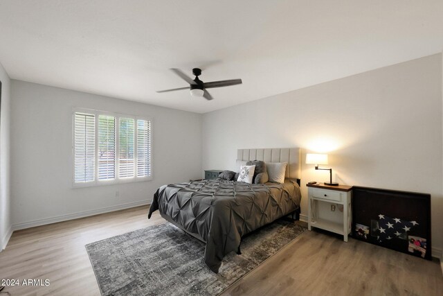 bedroom featuring light hardwood / wood-style floors and ceiling fan