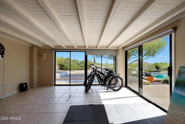 interior space featuring light tile patterned flooring and a healthy amount of sunlight