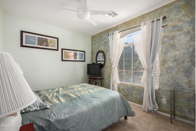 carpeted bedroom with ceiling fan