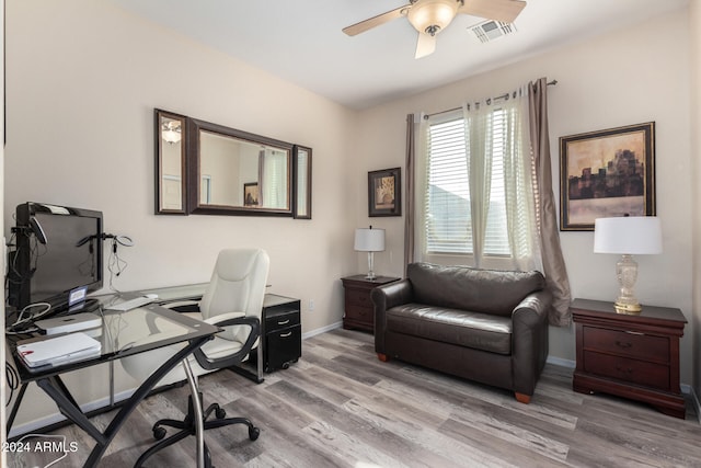 office with ceiling fan and light hardwood / wood-style floors