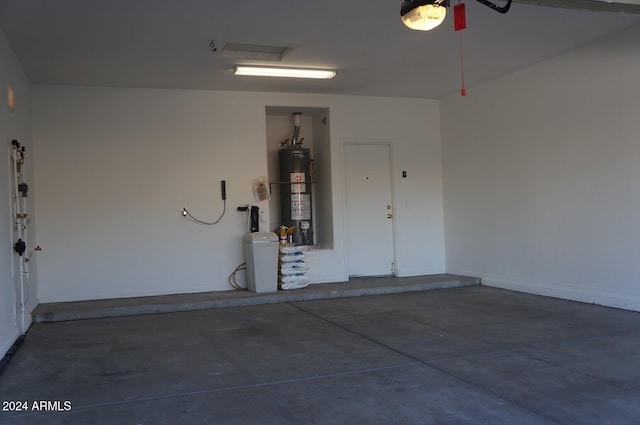 garage featuring a garage door opener and water heater