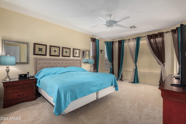 carpeted bedroom featuring ceiling fan