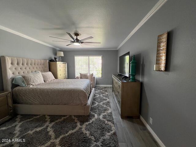 19014 N 91st Dr, Peoria, AZ 85382 - bedroom with crown molding, wood finished floors, baseboards, and ceiling fan