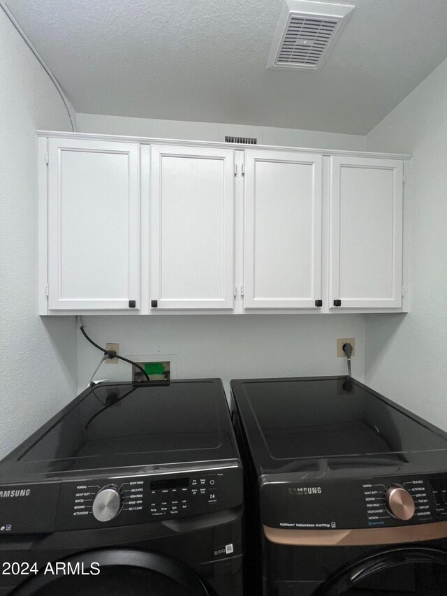 19014 N 91st Dr, Peoria, AZ 85382 - laundry room with cabinet space and independent washer and dryer