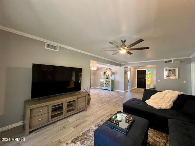 19014 N 91st Dr, Peoria, AZ 85382 - living area featuring light wood-type flooring, baseboards, crown molding, and ceiling fan