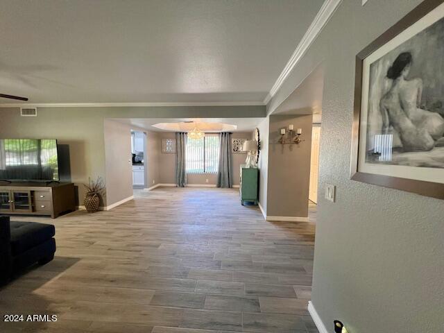 19014 N 91st Dr, Peoria, AZ 85382 - hallway featuring ornamental molding, baseboards, and wood finished floors
