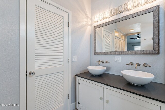 bathroom featuring vanity and ceiling fan