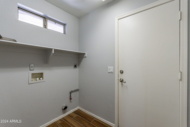 washroom with hookup for a washing machine, gas dryer hookup, hookup for an electric dryer, and dark hardwood / wood-style flooring