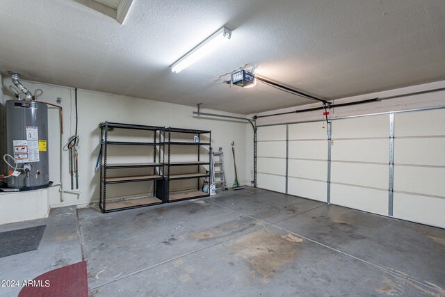 garage with water heater and a garage door opener