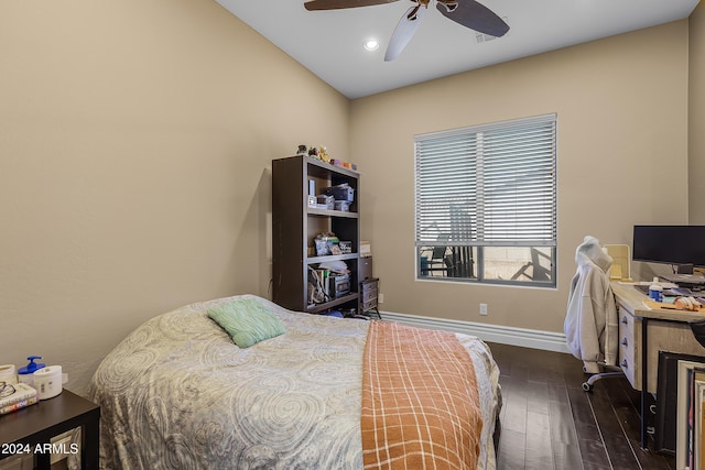 bedroom featuring ceiling fan and dark hardwood / wood-style flooring