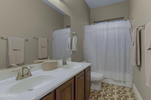 full bathroom featuring vanity, toilet, and shower / tub combo with curtain