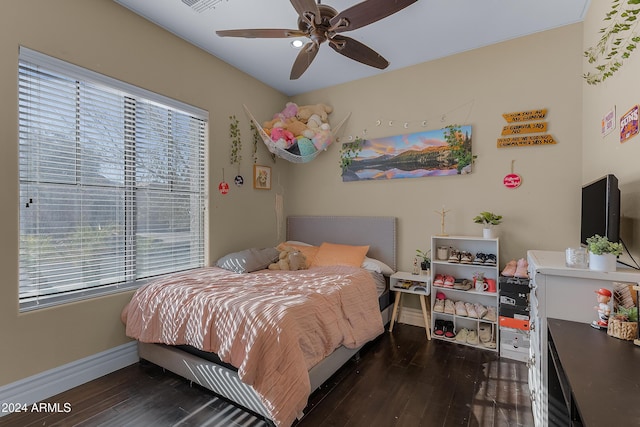 bedroom featuring ceiling fan and dark wood-type flooring