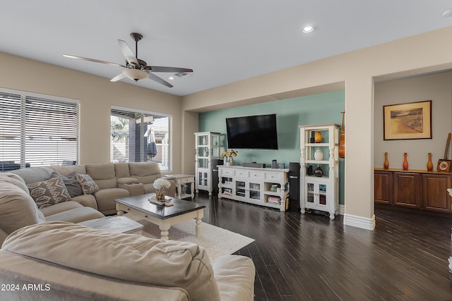 living room featuring dark hardwood / wood-style floors and ceiling fan