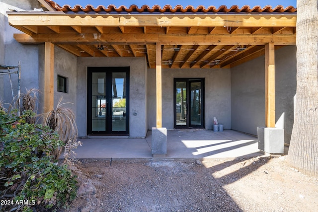 doorway to property featuring french doors and a patio area