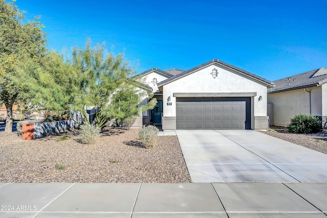 4714 W Nutmeg Ave, Coolidge, AZ 85128 - ranch-style house with an attached garage, driveway, and stucco siding