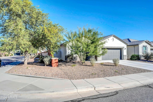 4714 W Nutmeg Ave, Coolidge, AZ 85128 - view of front facade featuring stucco siding, a garage, and driveway