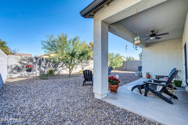 4714 W Nutmeg Ave, Coolidge, AZ 85128 - fenced backyard with ceiling fan and a patio