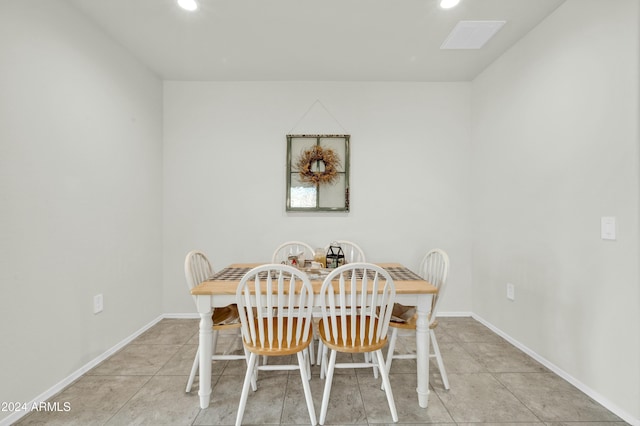 dining space with light tile patterned flooring