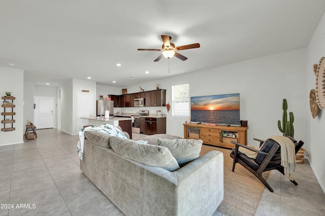 tiled living room with ceiling fan