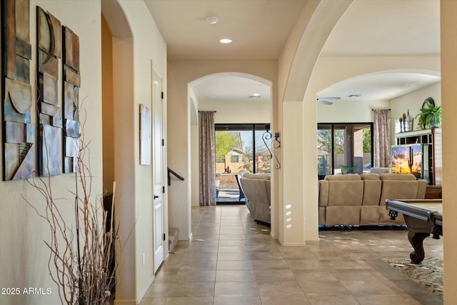 8733 E Jacaranda St, Mesa, AZ 85207 - corridor featuring arched walkways, baseboards, and recessed lighting