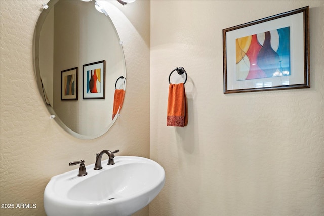 8733 E Jacaranda St, Mesa, AZ 85207 - bathroom with a textured wall and a sink