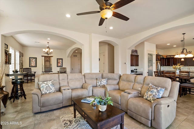 8733 E Jacaranda St, Mesa, AZ 85207 - living area featuring recessed lighting, arched walkways, and ceiling fan with notable chandelier