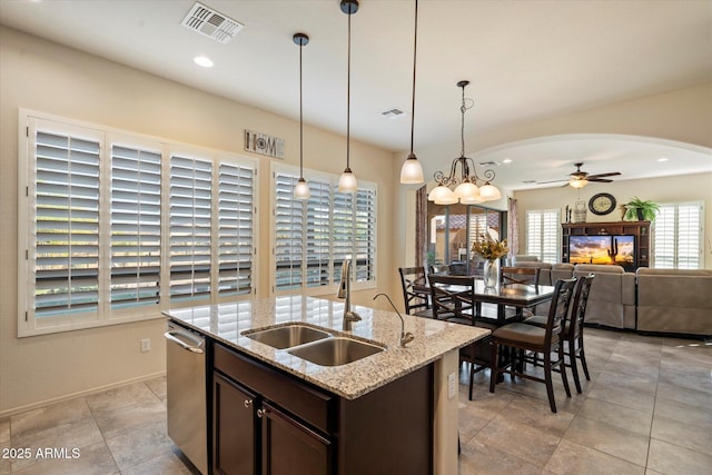 8733 E Jacaranda St, Mesa, AZ 85207 - kitchen featuring visible vents, arched walkways, a sink, ceiling fan, and dark brown cabinetry