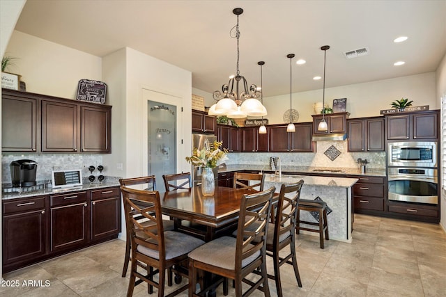 8733 E Jacaranda St, Mesa, AZ 85207 - dining space with visible vents, recessed lighting, and a notable chandelier