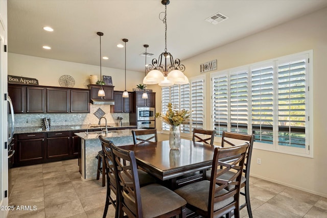 8733 E Jacaranda St, Mesa, AZ 85207 - dining area with visible vents, baseboards, recessed lighting, and an inviting chandelier