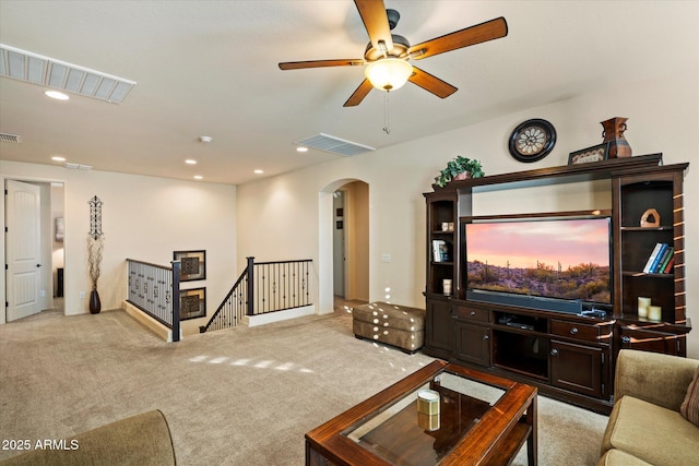 8733 E Jacaranda St, Mesa, AZ 85207 - living area with a ceiling fan, arched walkways, light carpet, and visible vents