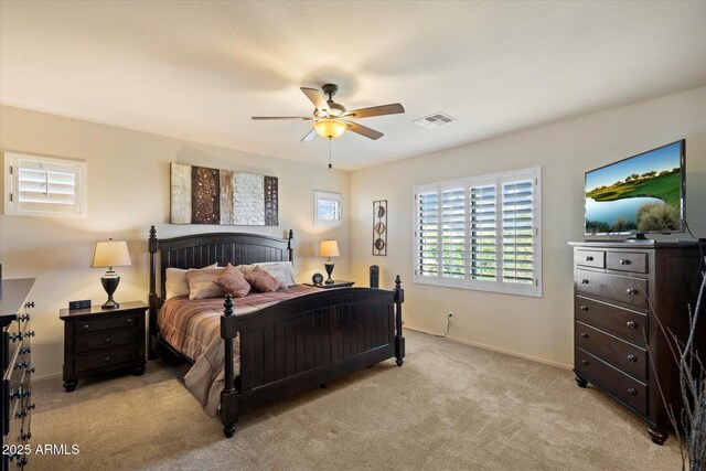 8733 E Jacaranda St, Mesa, AZ 85207 - bedroom featuring visible vents, light colored carpet, baseboards, and a ceiling fan