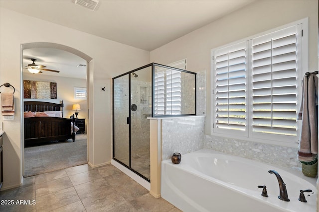 8733 E Jacaranda St, Mesa, AZ 85207 - bathroom featuring visible vents, ensuite bathroom, ceiling fan, a stall shower, and a garden tub