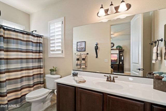 8733 E Jacaranda St, Mesa, AZ 85207 - bathroom featuring toilet, curtained shower, and vanity
