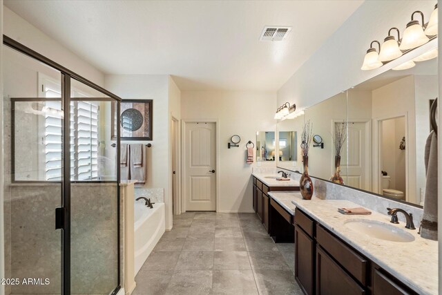 8733 E Jacaranda St, Mesa, AZ 85207 - full bathroom featuring a shower stall, a bath, vanity, visible vents, and toilet