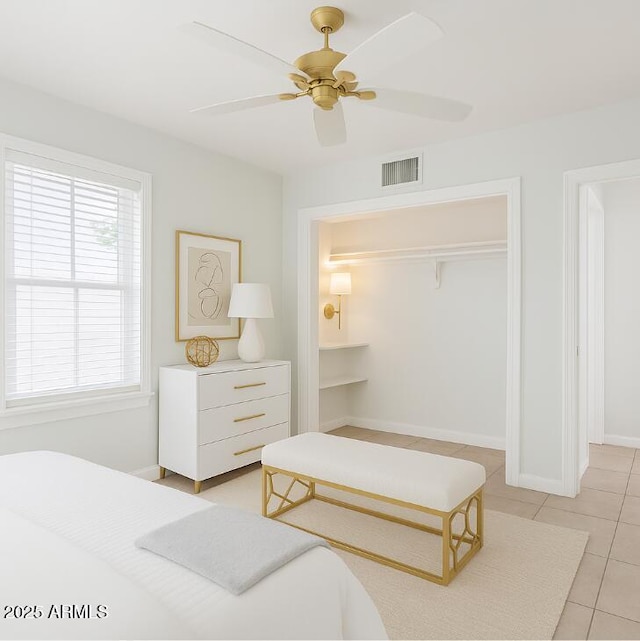 445 W 1st St, Mesa, AZ 85202 - bedroom featuring light tile patterned floors, multiple windows, ceiling fan, and a closet