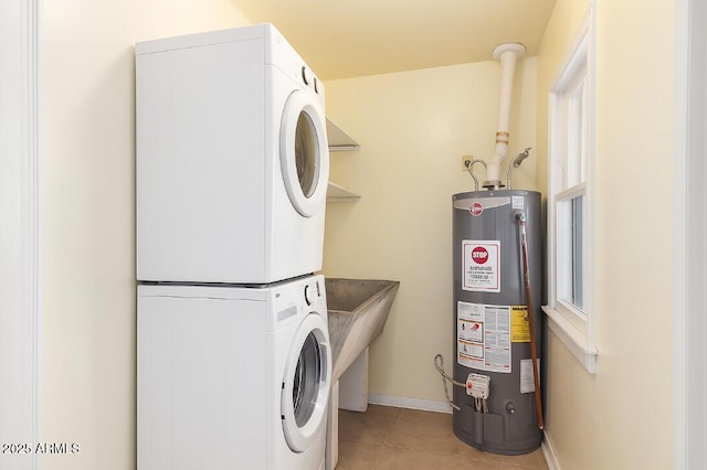 445 W 1st St, Mesa, AZ 85202 - laundry room featuring water heater, stacked washer and clothes dryer, and light tile patterned flooring