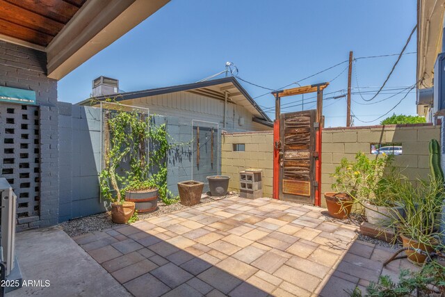 445 W 1st St, Mesa, AZ 85202 - view of patio / terrace with a gate