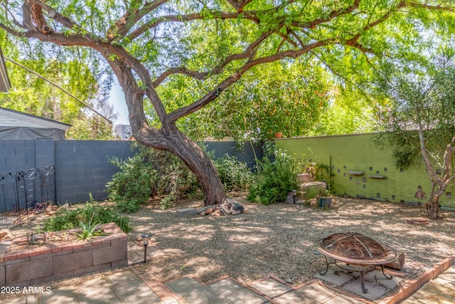 445 W 1st St, Mesa, AZ 85202 - fenced backyard featuring a fire pit and a patio area