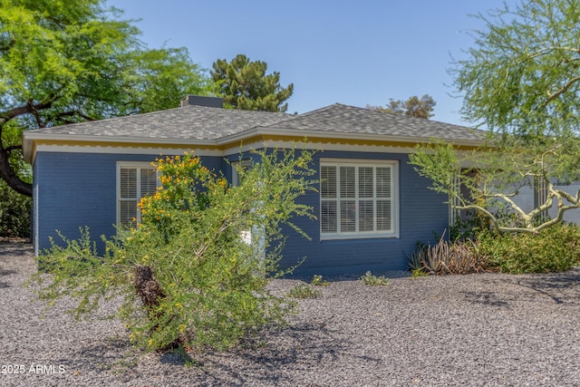 445 W 1st St, Mesa, AZ 85202 - view of side of property featuring roof with shingles