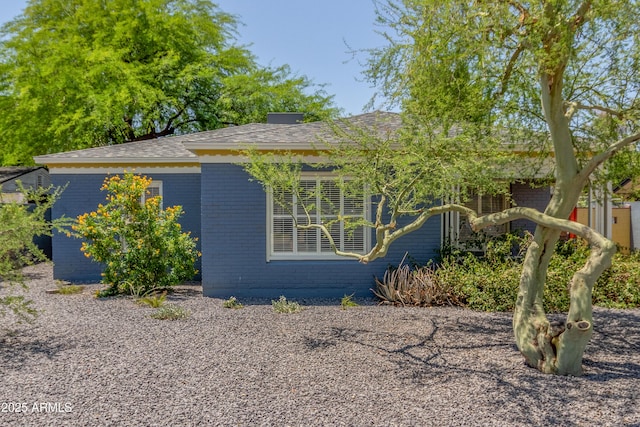 445 W 1st St, Mesa, AZ 85202 - view of front facade with brick siding and roof with shingles