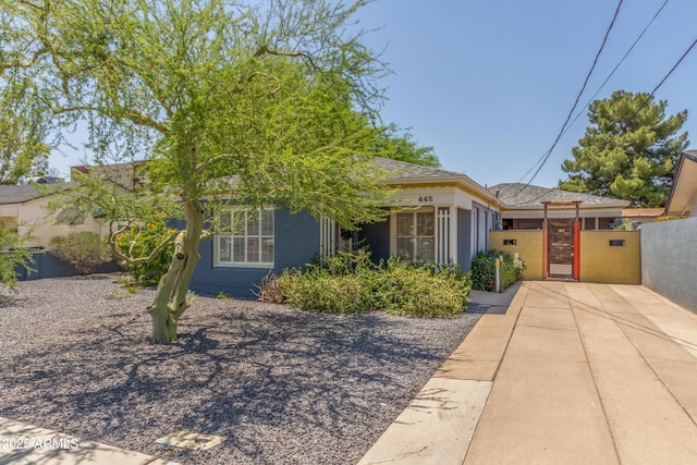 445 W 1st St, Mesa, AZ 85202 - obstructed view of property featuring a gate and brick siding