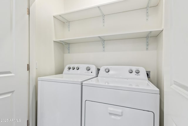 clothes washing area featuring laundry area and washing machine and dryer